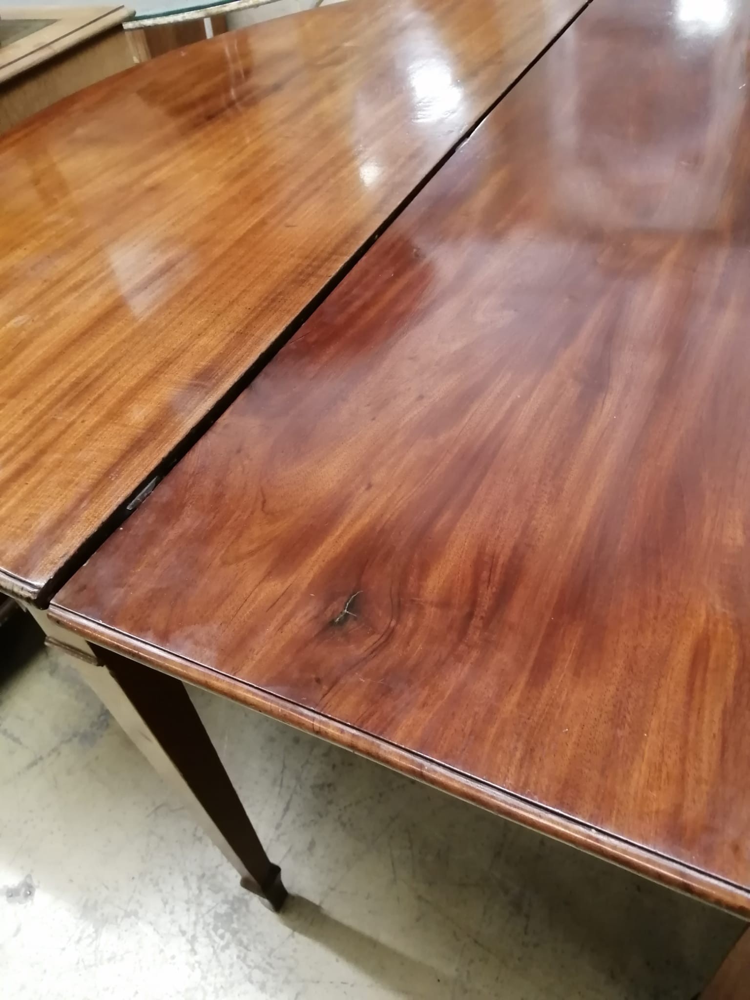 A George III mahogany D end extending dining table 304cm extended, two spare leaves, depth 122cm, height 74cm